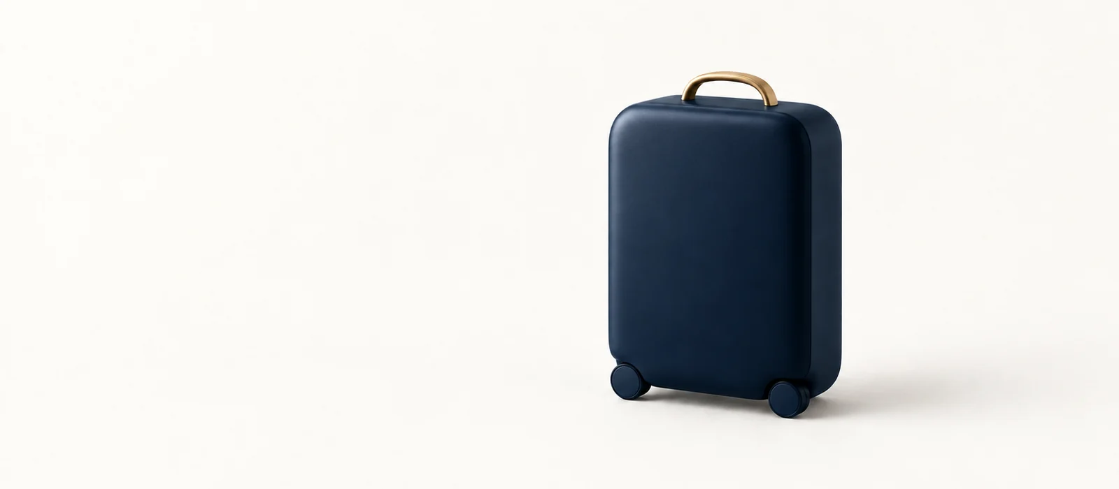 A matte navy hard-shell suitcase with a gold handle, on warm paper.