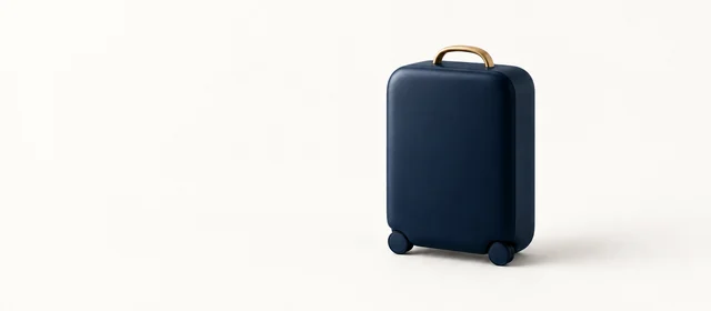 A matte navy hard-shell suitcase with a gold handle, on warm paper.