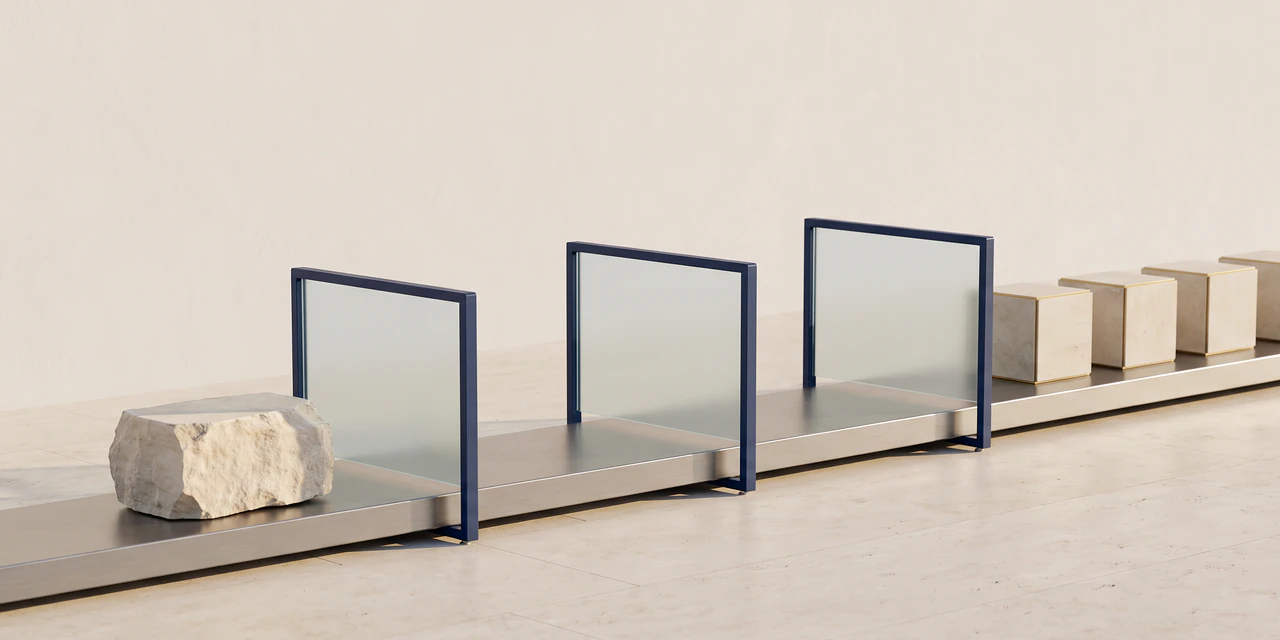 A rough limestone block enters a steel conveyor, passes through three frosted glass gates in navy frames and leaves as a row of identical squared blocks